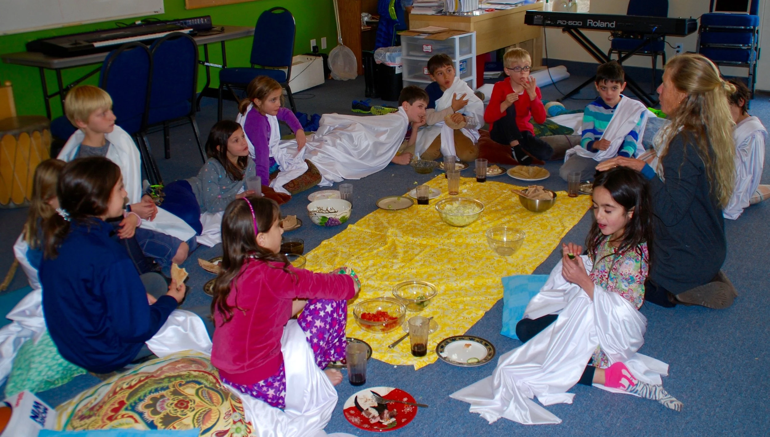 A Greek Feast with meat cooked over a spit outside, grapes, bread they made and other delicacies!