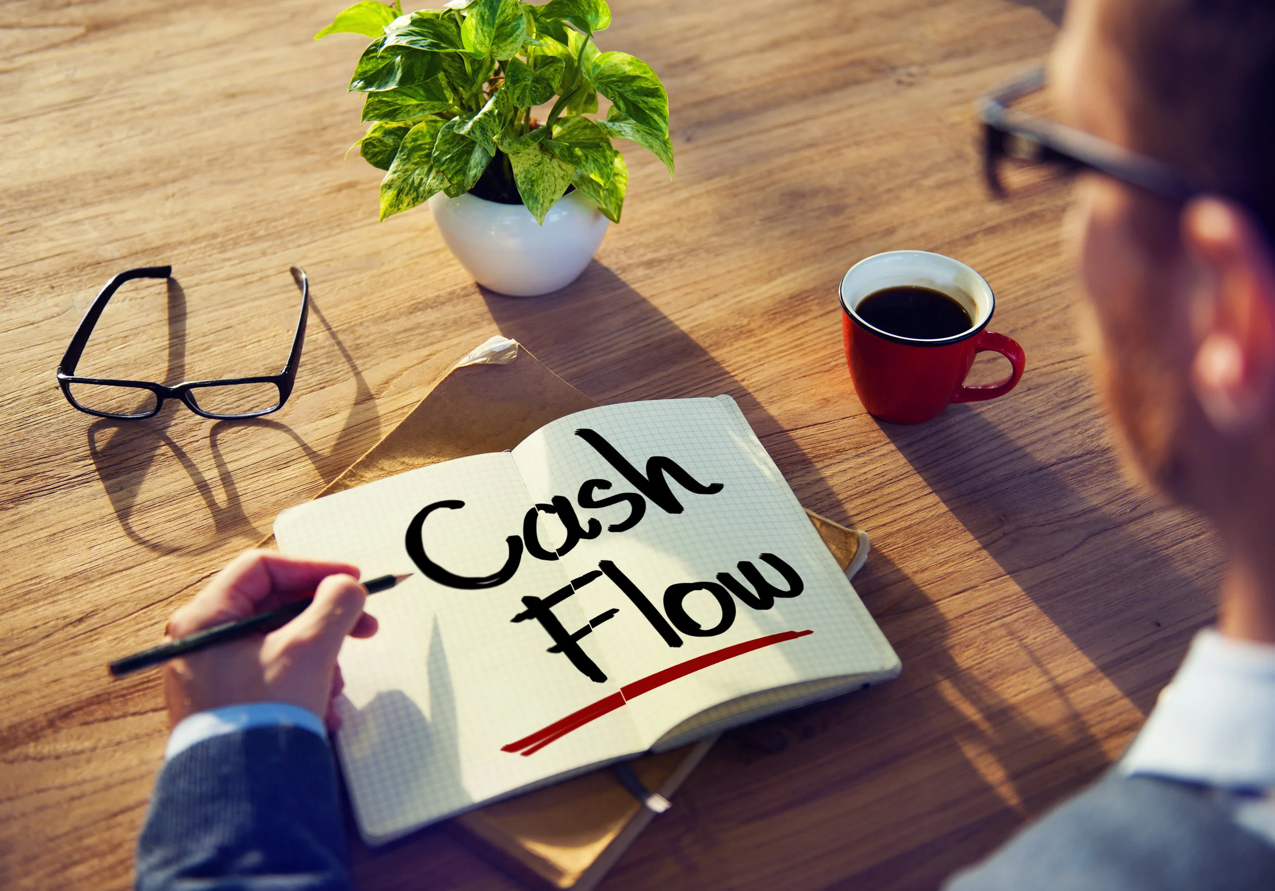 Man with a Note and Cash Flow Concept