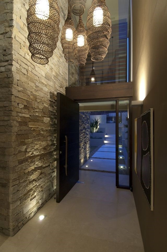  Up lighting makes this narrow space feel tall and expansive as well as accentuating the architectural features of the stone and entry fixtures – which are super awesome!
