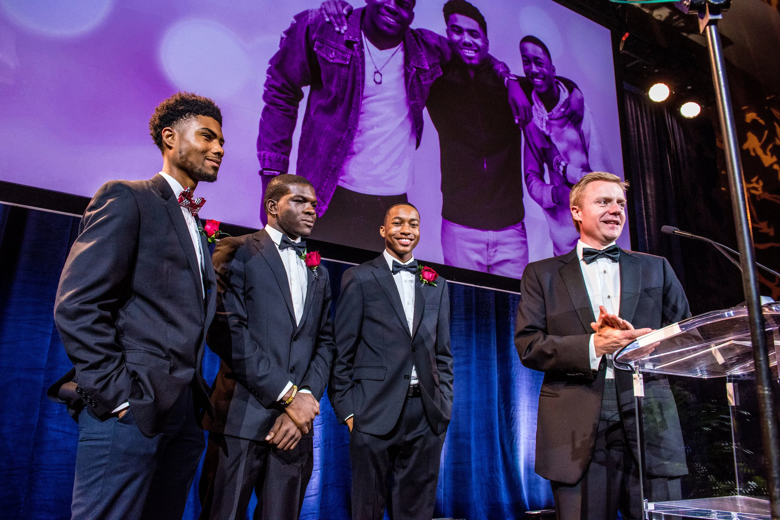 Photographed from Left to Right: JA Academy at Banneker High School Juniors: Apollo Gunn, Daniel Albadey, and Octavious Taylor, Jack Harris, President and CEO, JA of Georgia.