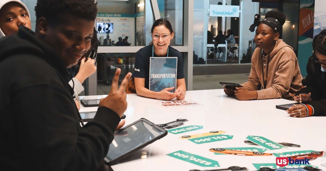 U.S. Bank volunteers chose to invest their Tuesday by empowering Georgia's middle schoolers. They helped students learn how expensive cell phones are 📱(no, they do not grow on cell towers), and how different models of cars create different types of 