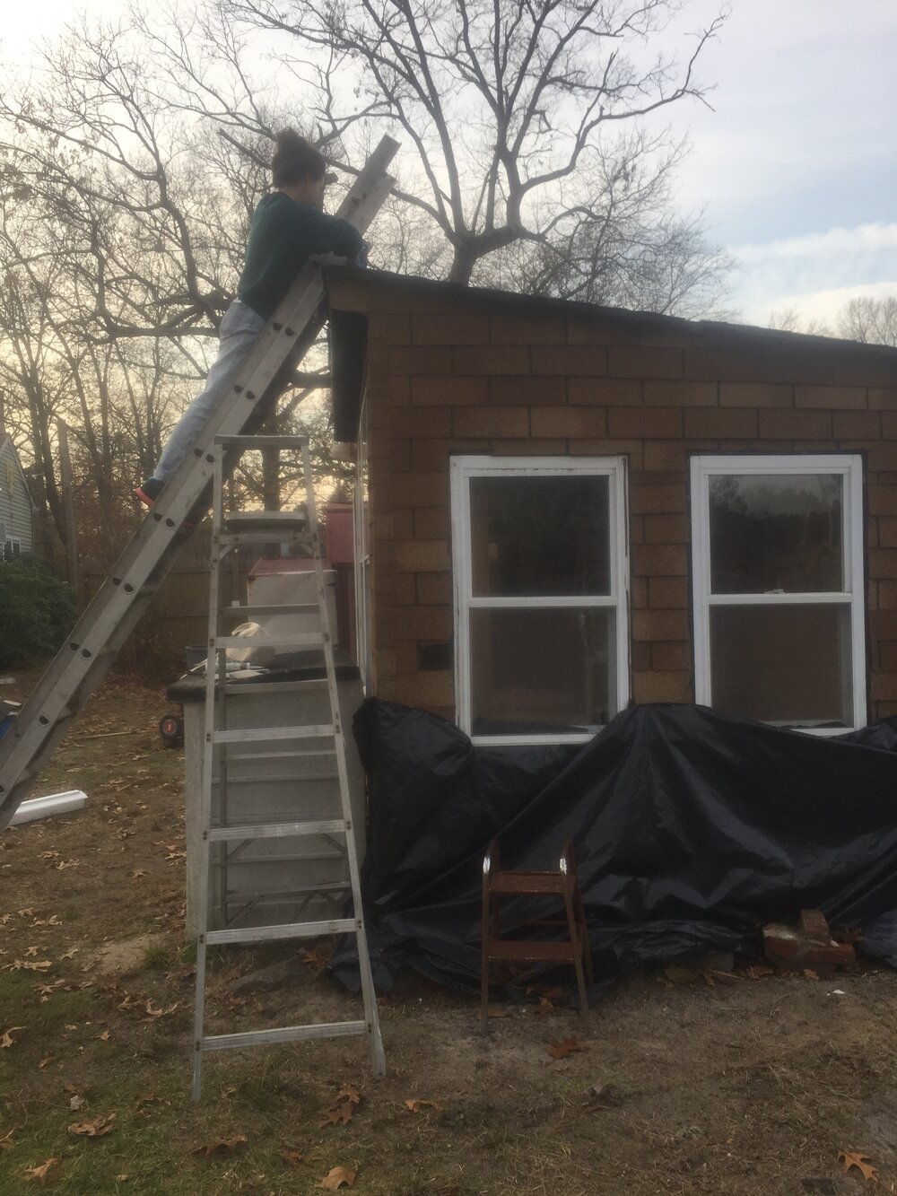 Repairing the roof of an old shed.