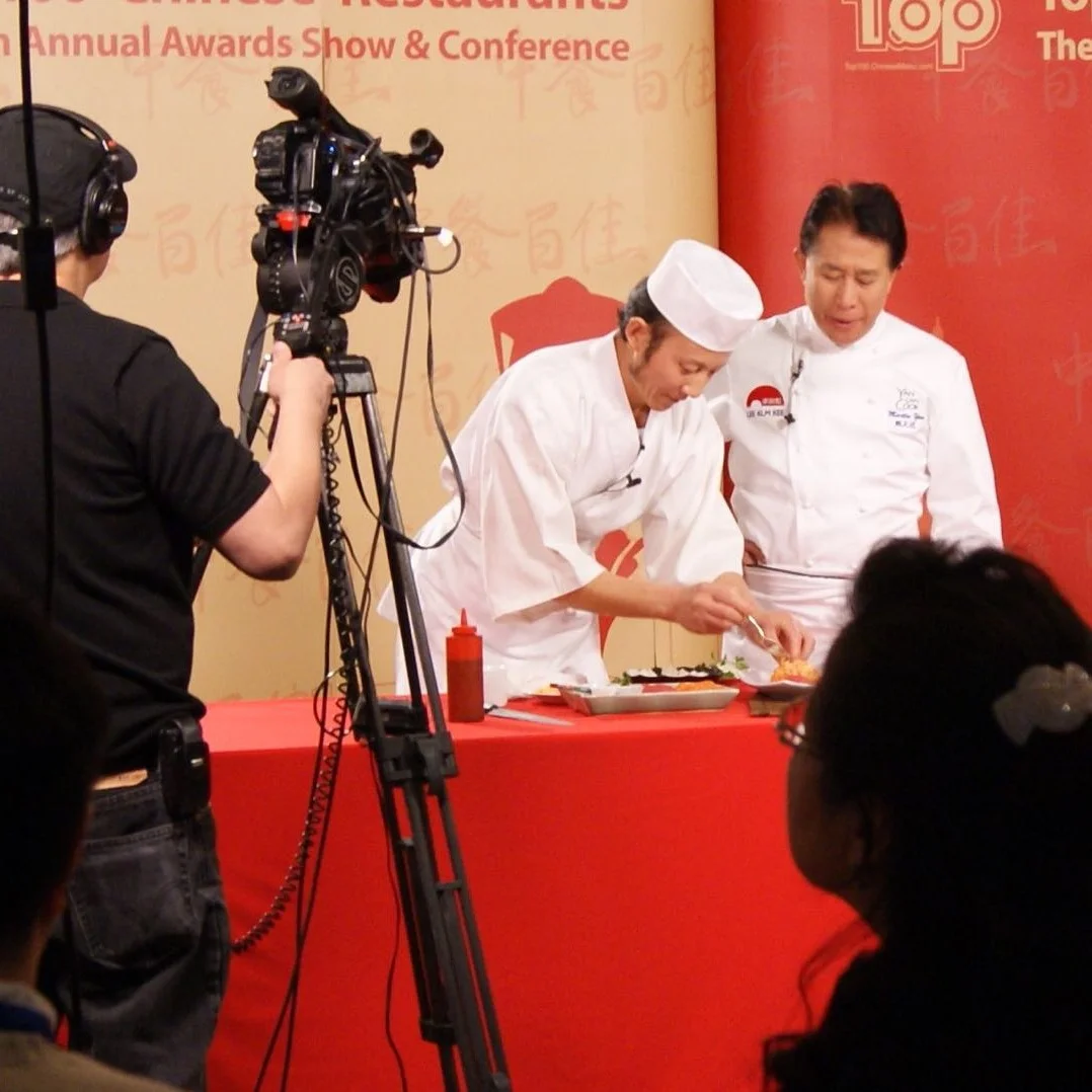 Robert Luo crafting sushi with Martin Yan