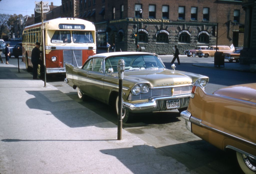 The city of Sudbury, Ontario, claims the honour of having installed the country’s first parking metres in August of 1940. Town bus on Queen Street West at Main Street, Brampton, Ont., c.1960. Region of Peel Archives/Cecil Chinn Fonds. 