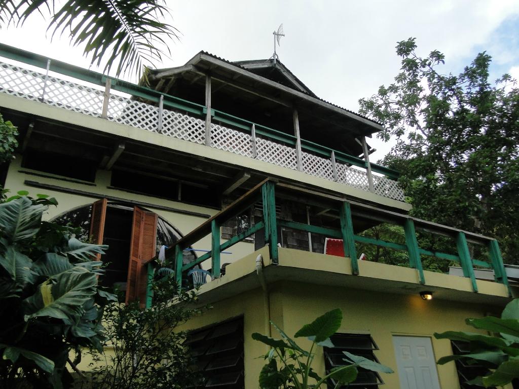 Peer into the rainforest or view the Caribbean sea below on one of Sue's many spectacular porches.