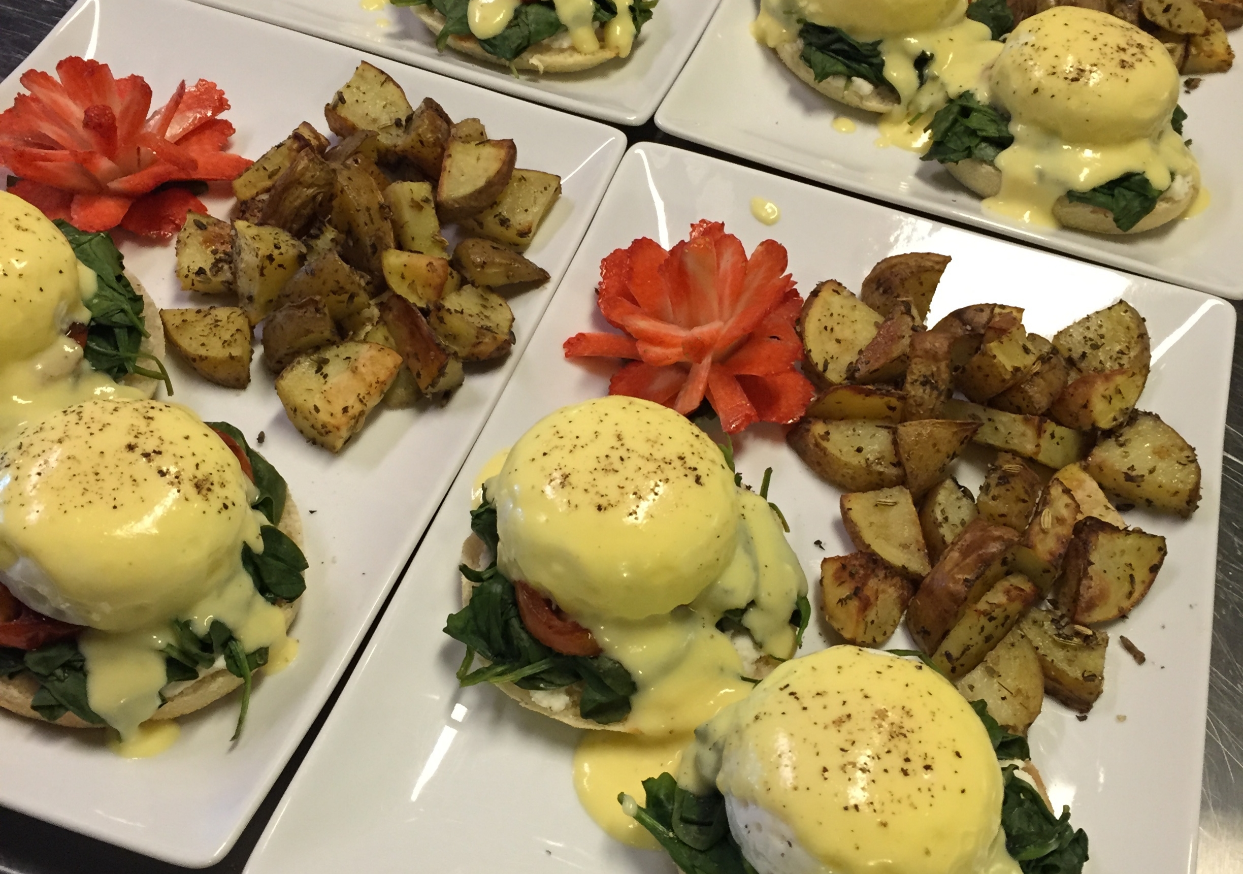 Enjoy a delicious vegetarian breakfast every morning--here you have a traditional Eggs Florentine with roasted potatoes.