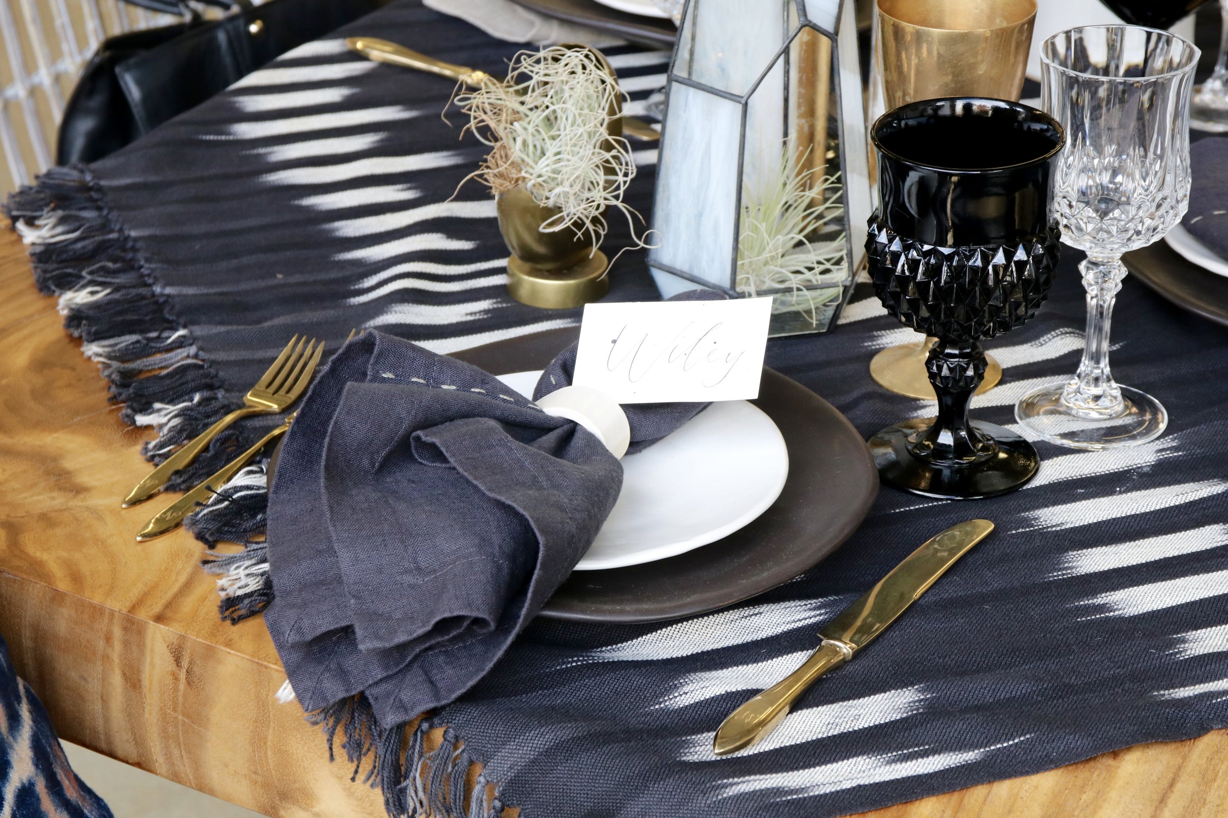 A throw blanket in Ikat pattern from SB Millworks used as a runner