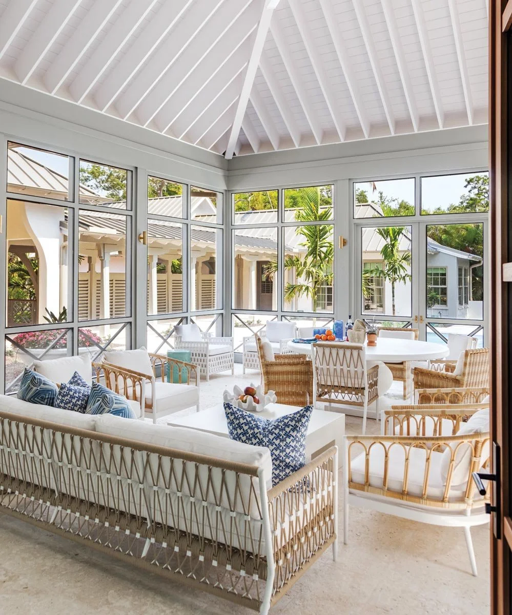 Designed-for-relaxing-dining-and-cooking-the-screened-porch-includes-generous-seating-a-summer-kitchen-and-natural-Dominican-coral-stone-flooring-blurring-indoor_outdoor-boundaries.jpg