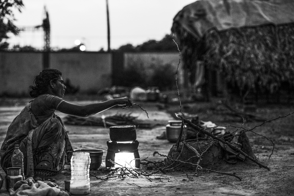 Chitra cooks in a small clay stove for her family of 6.