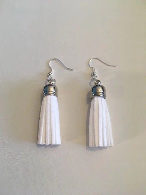 +White Leather Tassle Earrings