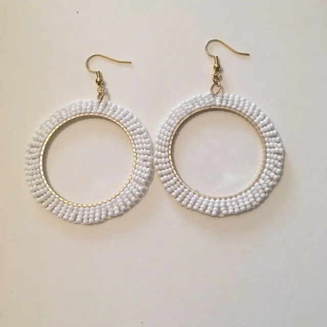+White beaded hoop earrings