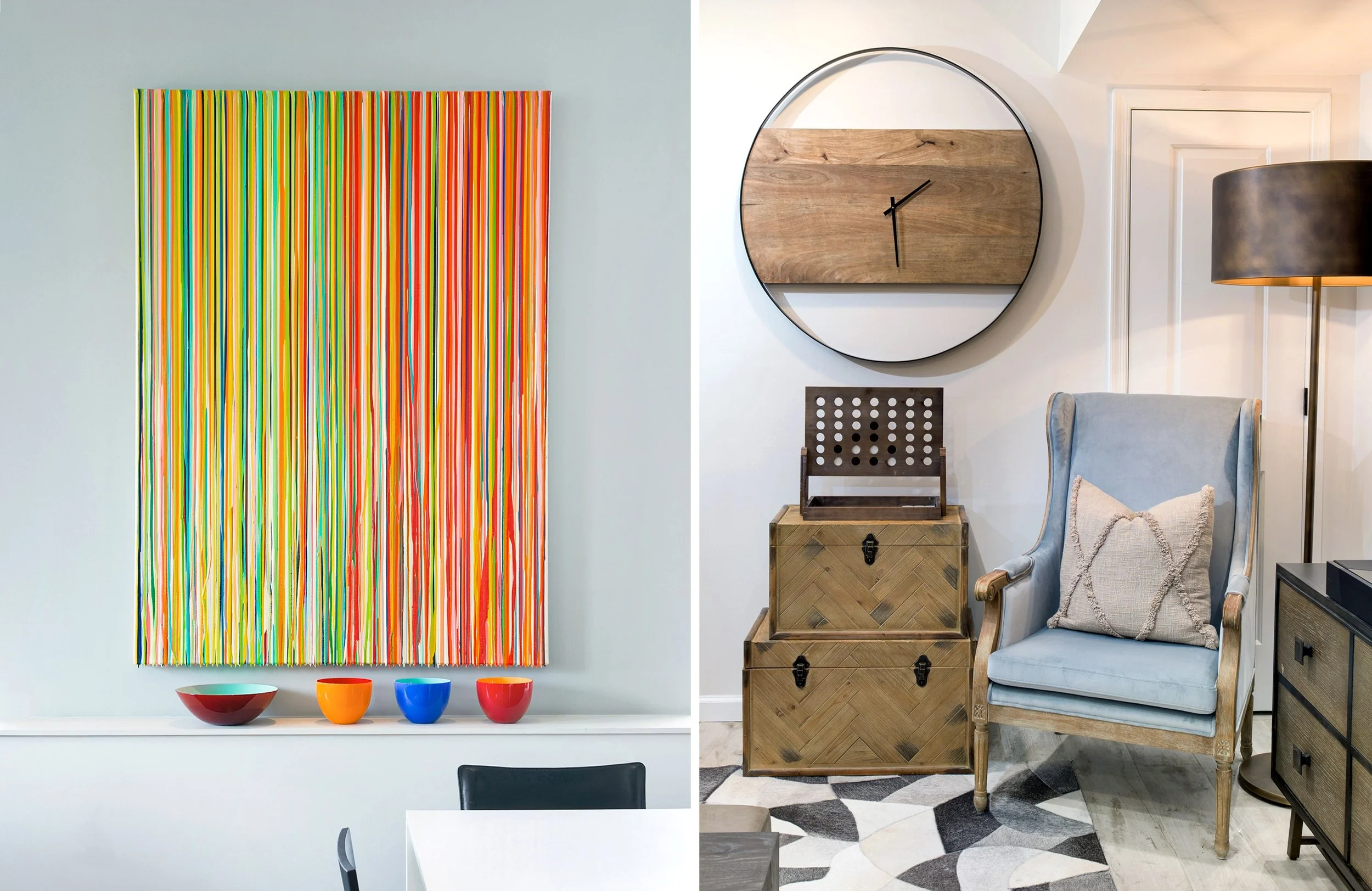 Interior decor with colorful abstract art, bowls on a white shelf, and a cozy reading nook with a blue armchair, wooden boxes, a large wall clock, and a black floor lamp.