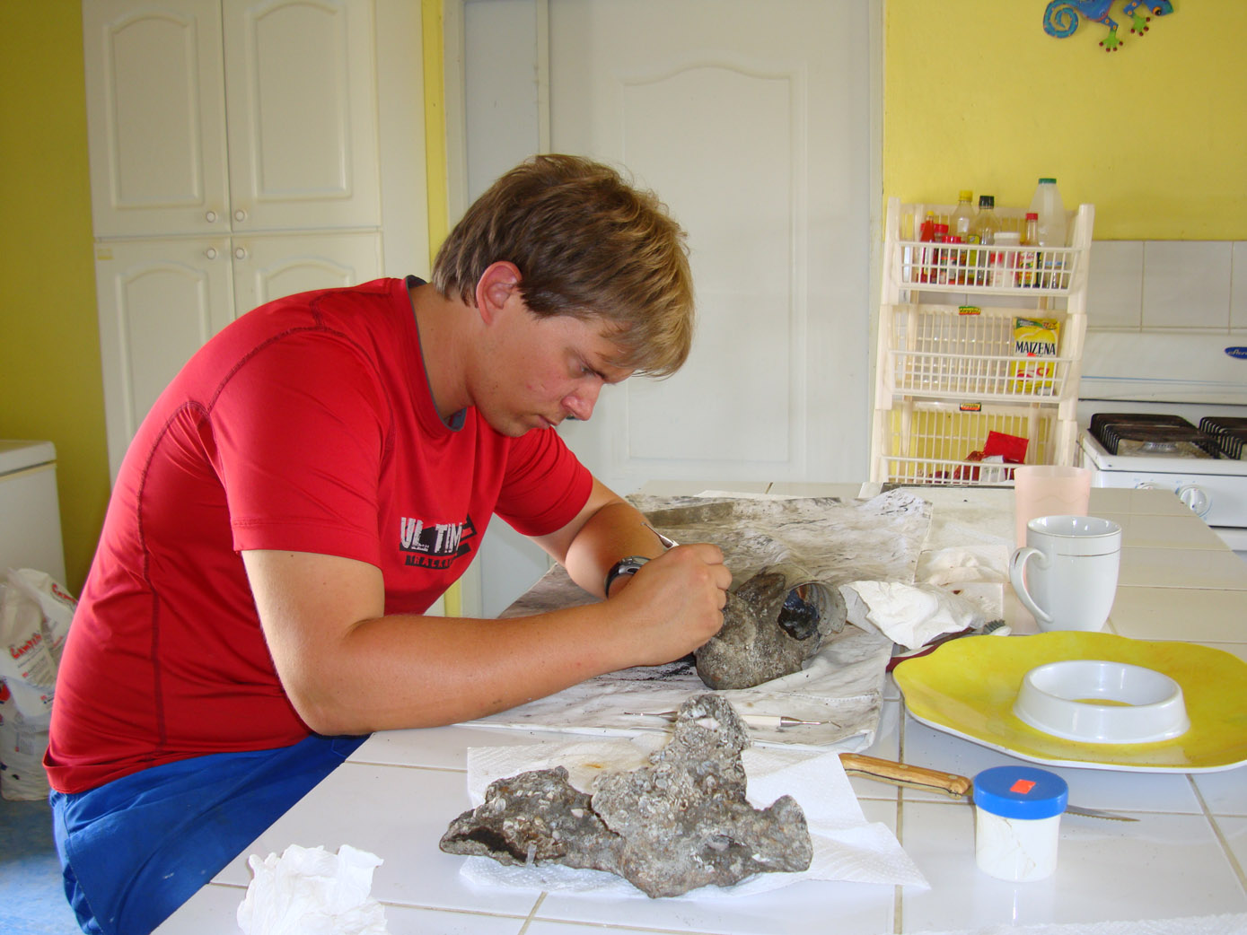 Wesley conserving an iron concretion from the Tile Wreck