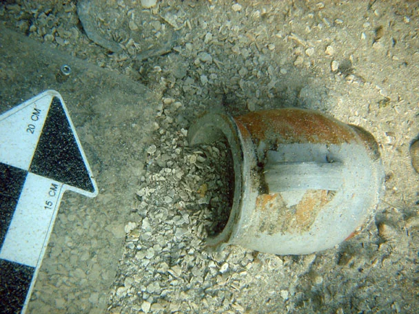 An intact stoneware mug found under the anchor 1 on The Tile Wreck