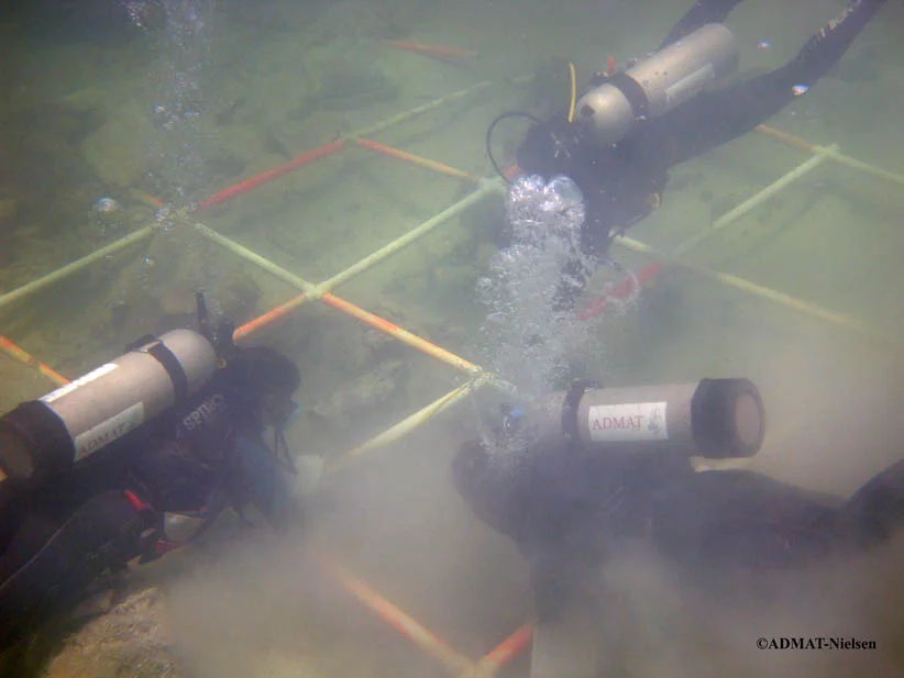 The Team hand fanning prior to measuring another section of the hull