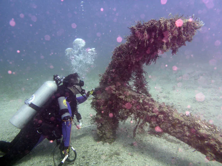 Project Leader John Downing with the anchor his Team located on the Wreck Two site in 2016
