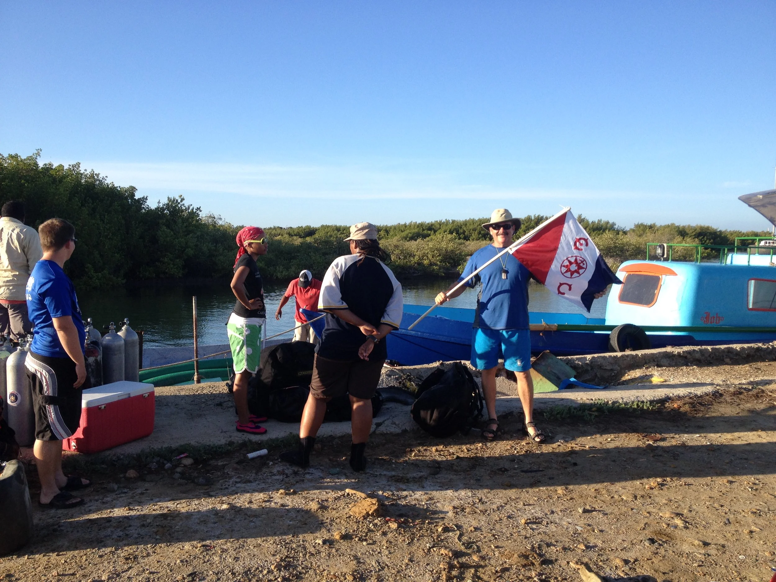  John holding the new ADMAT Explorers Club Flag on the way to the   Le Casimir   in 2014 