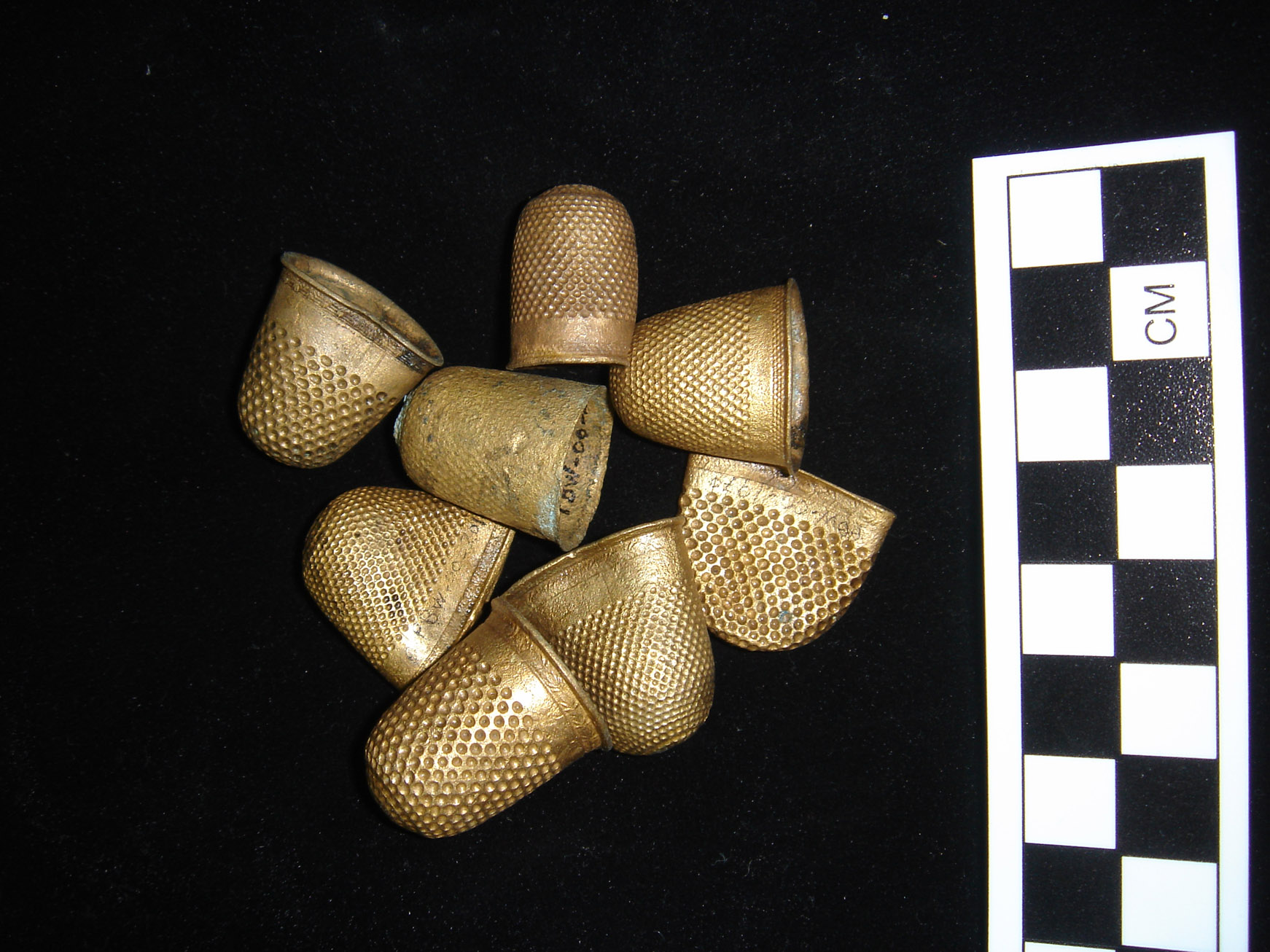  A collection of copper alloy gilt covered thimbles, which were part of the cargo, after ONPCS conservation 