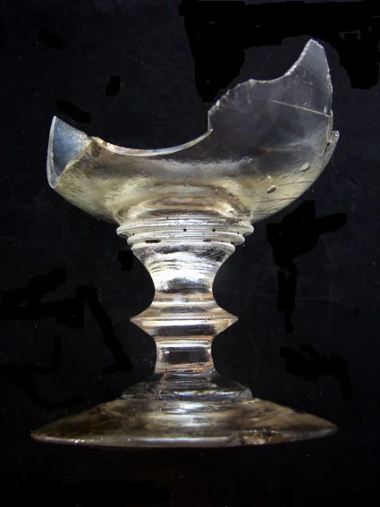 One of the broken lead crystal French wine goblets, smashed by the looters