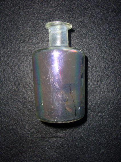  A flat bottomed glass perfume bottle 