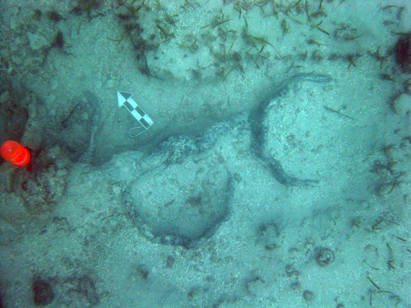  The first two of over eight iron hexagonal banks with anchor chain running past all concreted together. It is thought that these were lower mast rings 