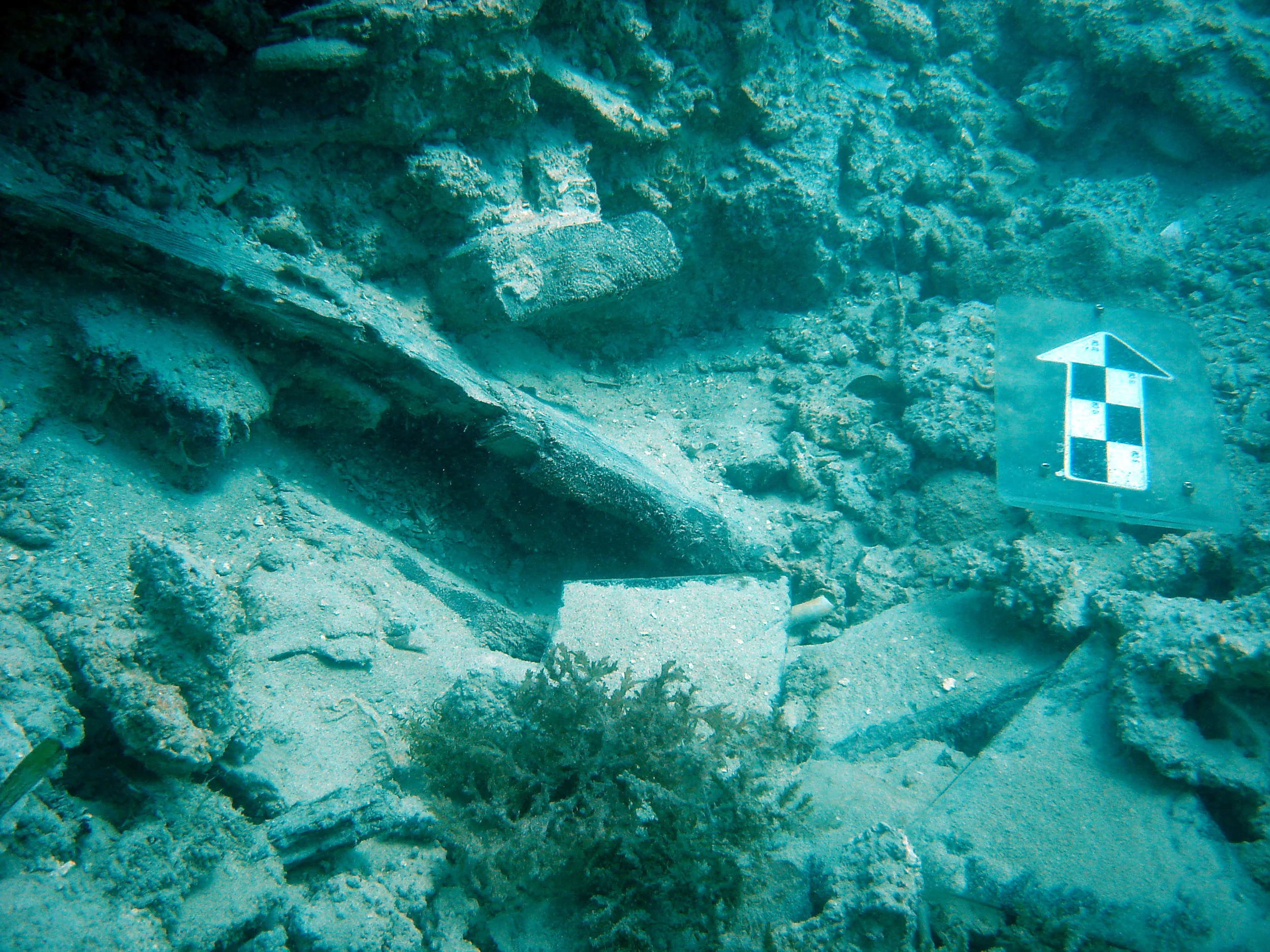 Timber and boxes of broken window glass, part of the cargo