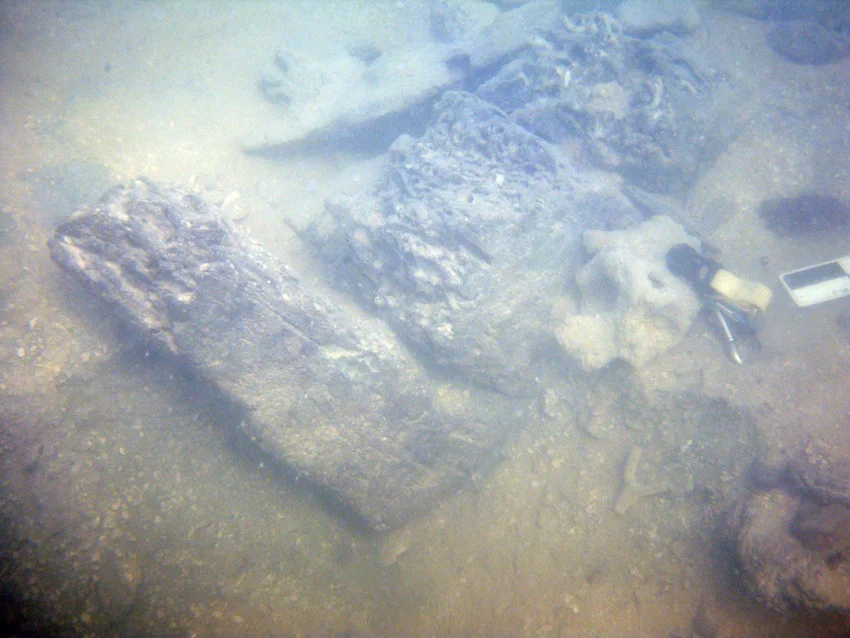 A side view of the three pieces of timber as they are uncovered