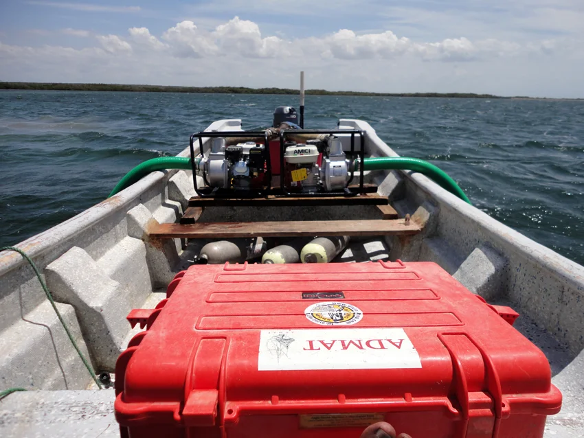 A simple and effective archaeological water dredge system of two trash pumps necked together with the water outputs joining underwater and going to the dredge head