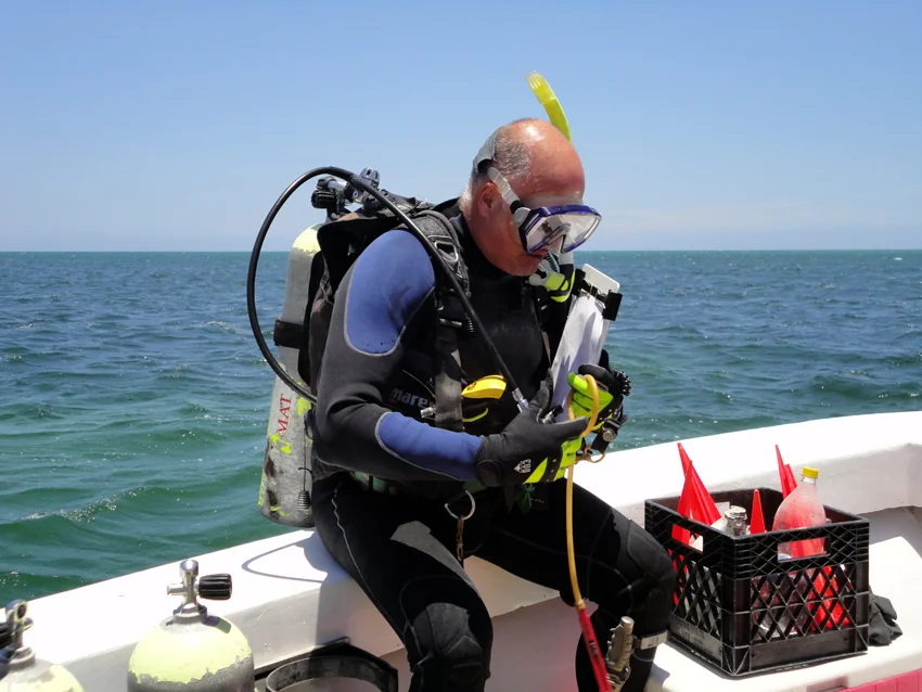 Raimund all ready to begin surveying, armed with tapes markers flags etc.