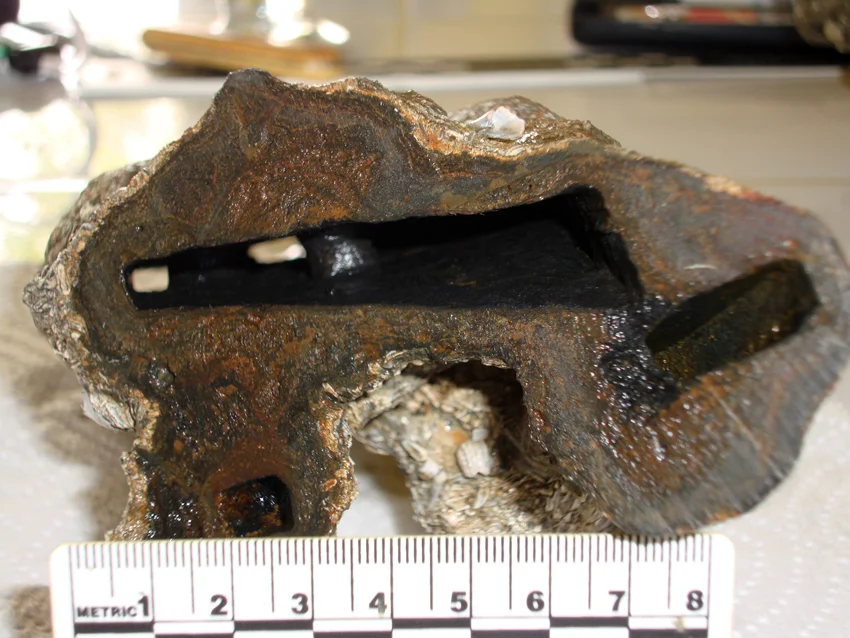 In the void there were holes which went through the iron object which were now occupied by concretion