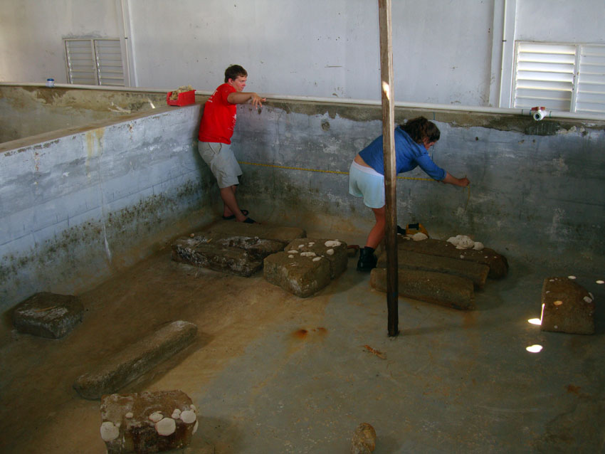  Wesley and Laura measuring the granite blocks which have been relocated in the same position as they were on the cargo deck of     The Tile Wreck    