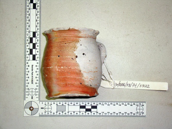 An intact saltware glazed stoneware mug which was located under anchor 1 on The Tile Wreck being documented at ONPCS