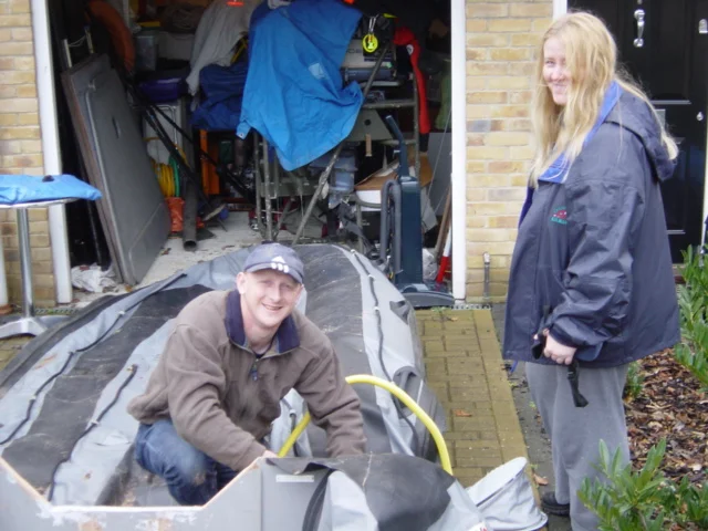 Christine assisting Chris. Note the garage full of equipment