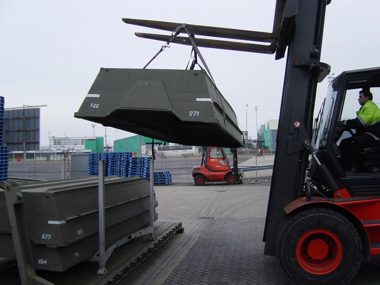 Easy with a forklift ... however it would be manpower at the other end on the beach
