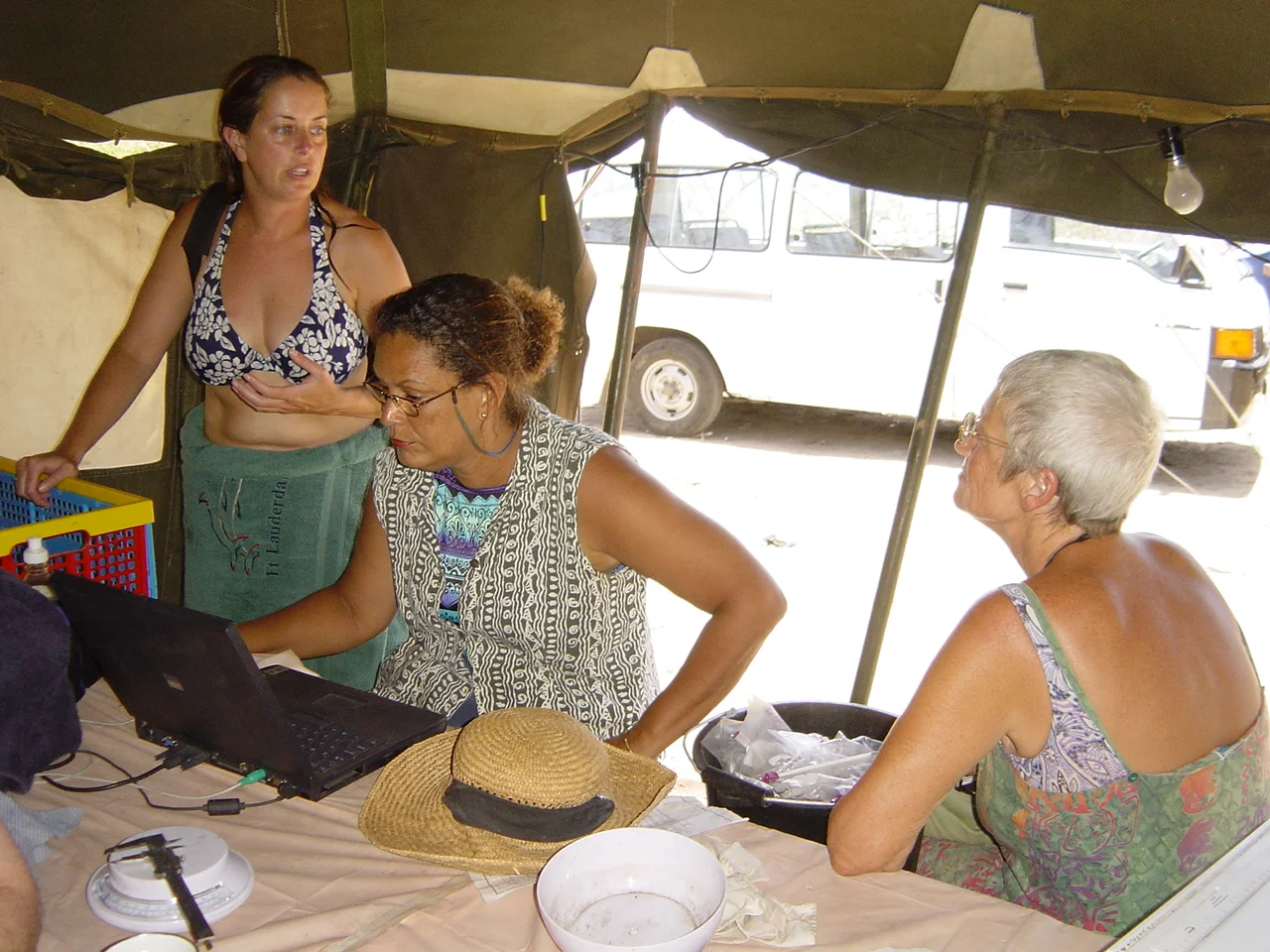 Kathy Schubert, Hazel Brooks and Dierdre Stubs start work on the artefacts