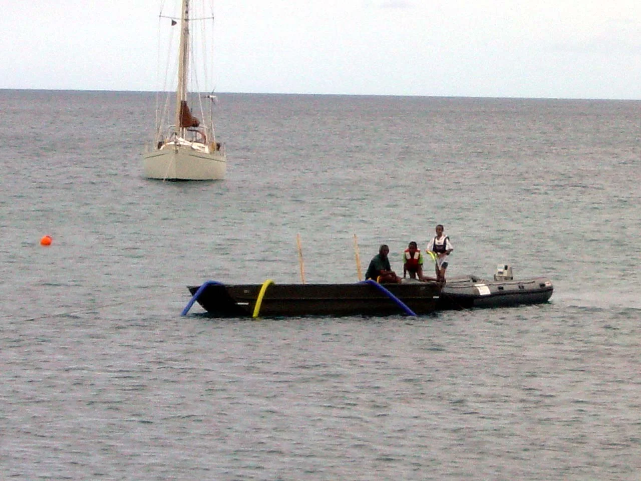 Jason shows his sons the wreck site from the work barge