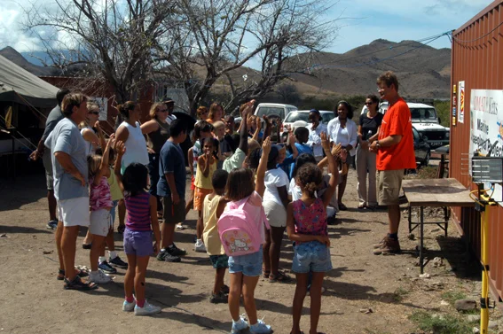 The school trip get a briefing on the project from Simon