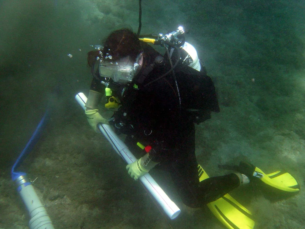 Matthew holding a piece of PVC piping for the grid