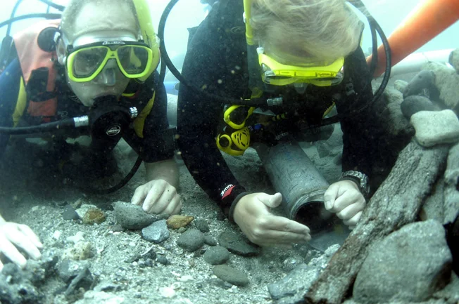 Christine shows student Amyas how delicate it is possible to work with a dredge