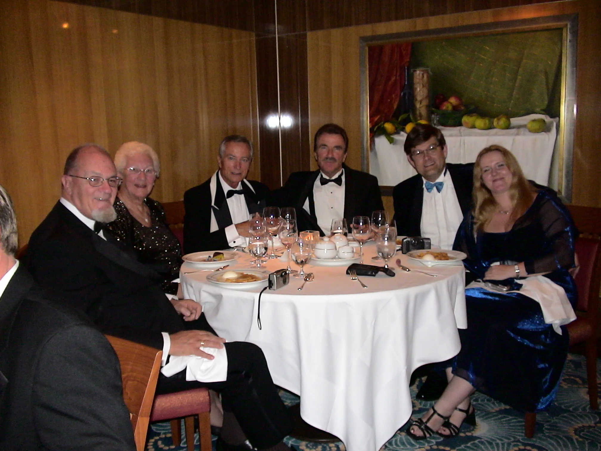 Simon and Christine hoasting a dinner table