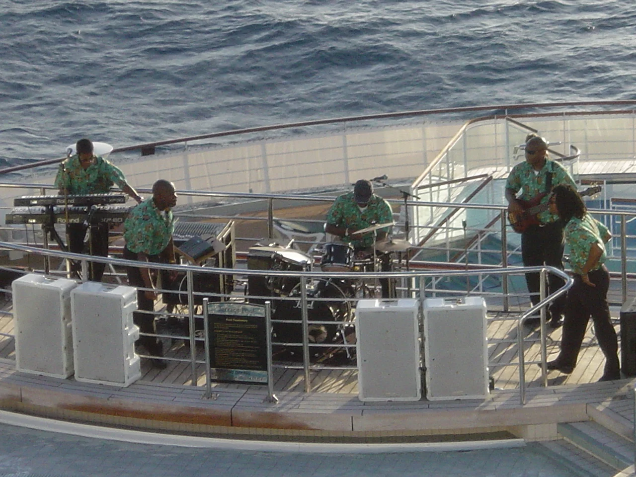 The party starts on the QM2 with the Caribbean band playing and the life boats dancing in the sunset