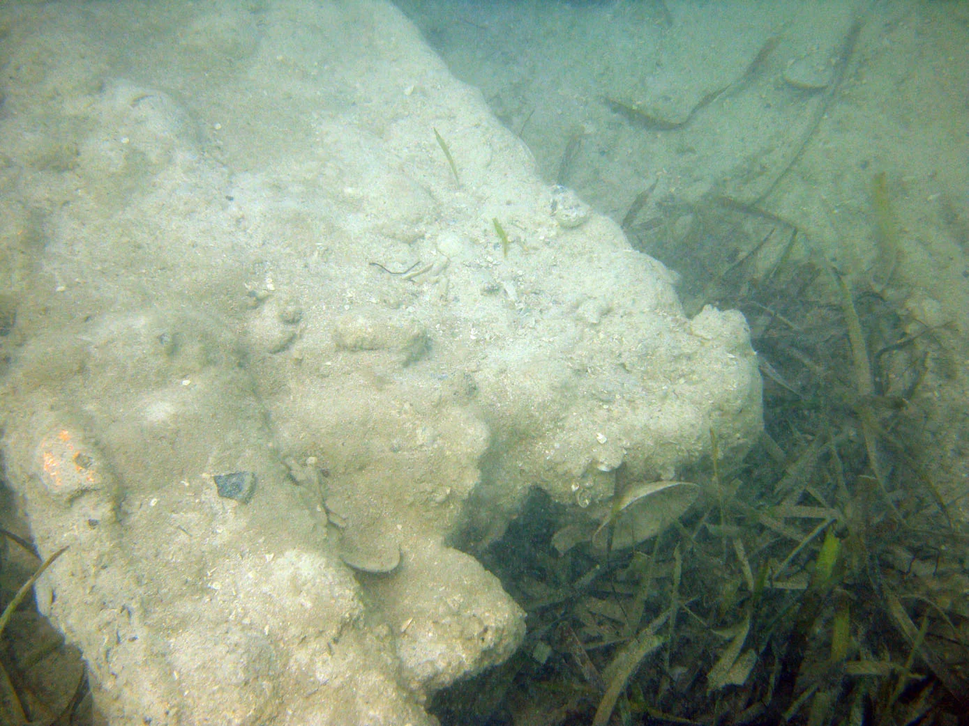 The rear end of the long sections of iron ballast on the amidships starboard side