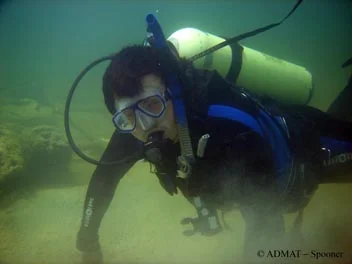 Student Fletcher inspecting The Tile Wreck