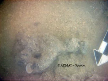 A possible truck pin found 1.67 meters from and 1.24 meters below the hull level