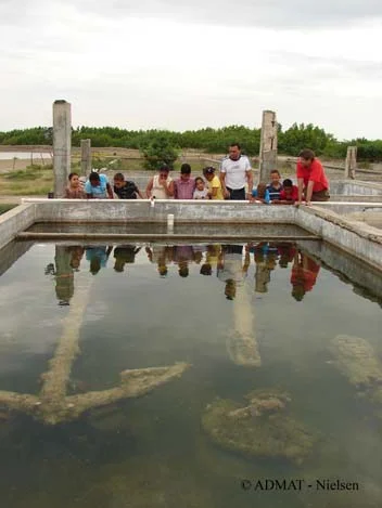 The students from John's English Schools youngest class and their principal Jonny E. Marte are shown anchors and cannons from The Tile Wreck site by Dr. Simon Q. Spooner.