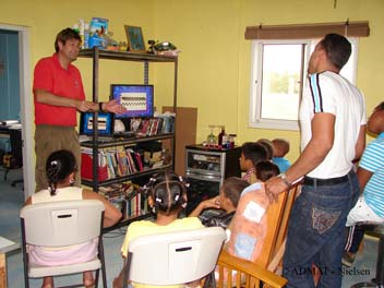 Simon showing the students a computer presentation and teaching them about Maritime Archaeology and their Underwater Cultural Heritage.