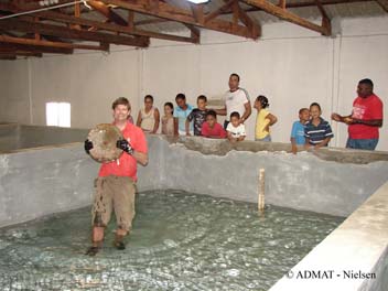Rami talks about The Faience Wreck while Simon puts the grinding wheel back in it's place in the conservation tank.