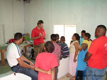 The students are shown faience pottery sherds from The Tile Wreck and told about how they were identified as French by assistance from ADMAT-FRANCE and museums in Paris.