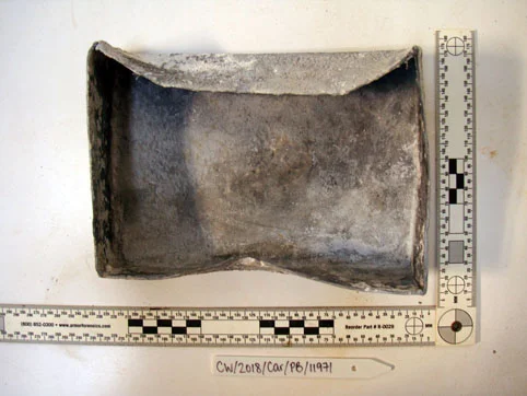 The inside of the lead box after the sand has been cleaned off