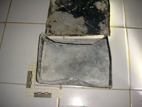 The underside of the lid next to the box